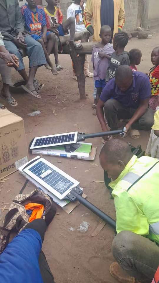 YC Solarlight LED street light install, Guinea